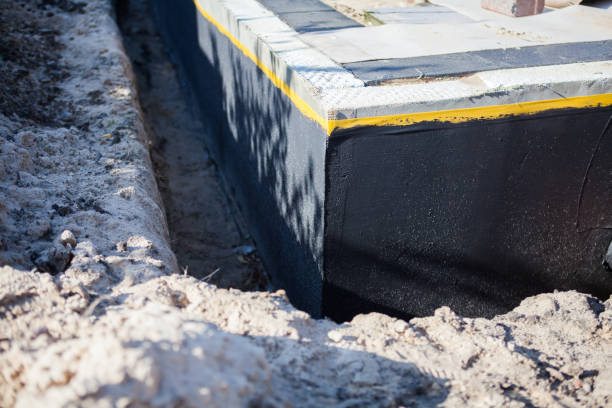 Professional Waterproofing technician working in Lawrence, MI